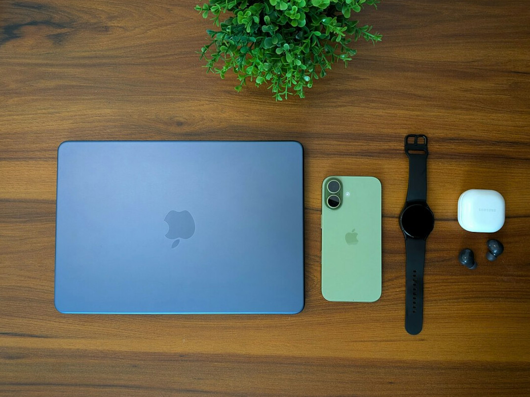 Notebook and laptop on a wooden desk